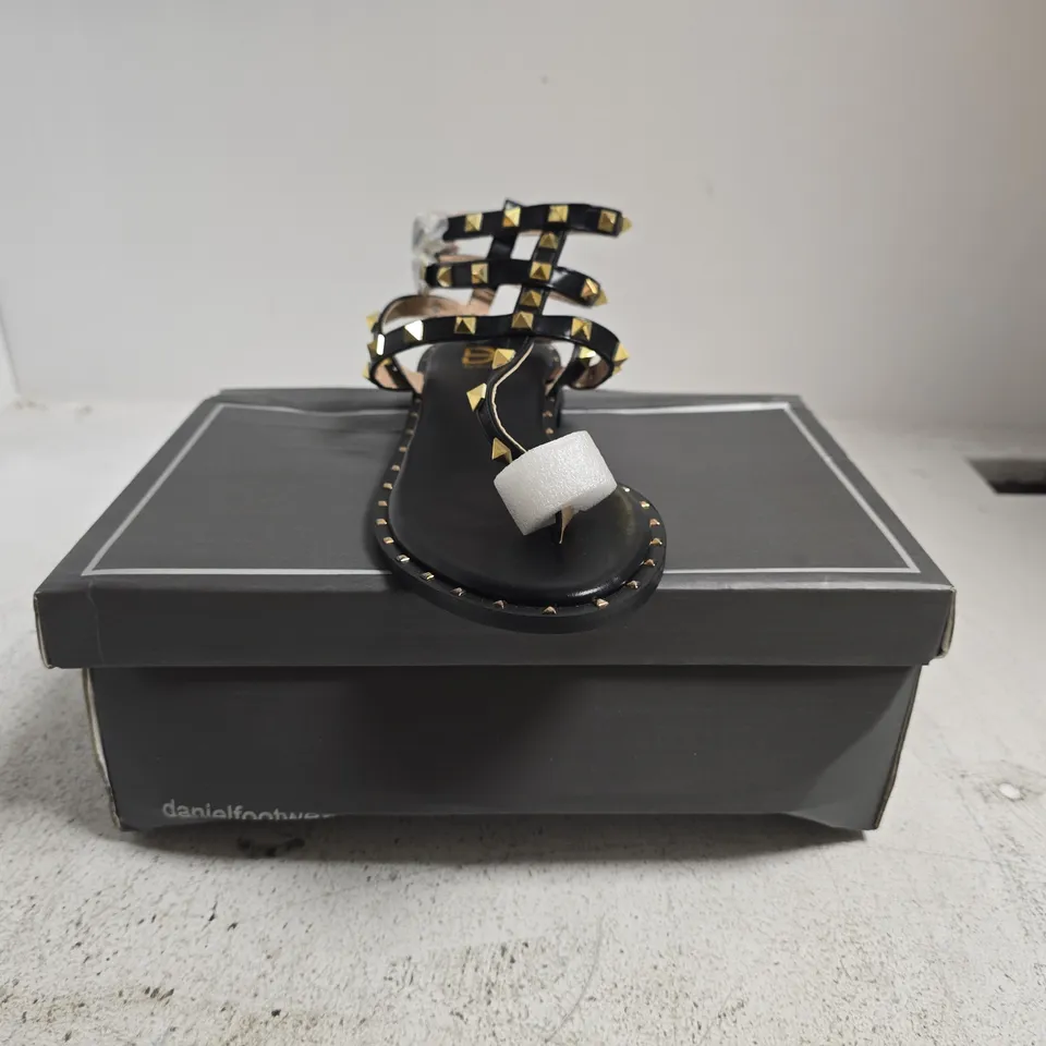 BOXED PAIR OF DANIEL TOE-POST STRAPPY SANDALS IN BLACK W. GOLD STUDS SIZE EU 39