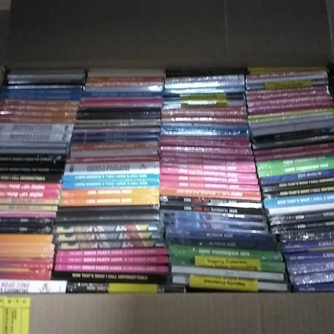 APPROXIMATELY 100 ASSORTED CDS AND DVDS TO INCLUDE NOW MUSIC 18, NOW YEARBOOK, AND NOW THAT'S WHAT I CALL ETC.