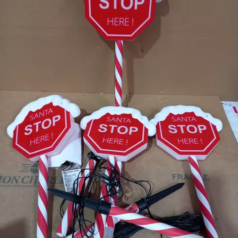 FESTIVE SET OF PRELIT SANTA STOP HERE STAKES