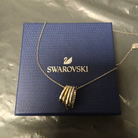 SWAROVSKI NECKLACE – STACKED RING PENDANT IN GOLD-TONE & SILVER-TONE