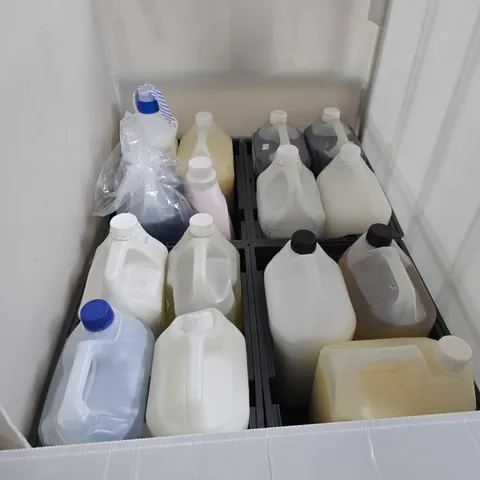 CAGE OF ASSORTED OVERSIZED LIQUIDS