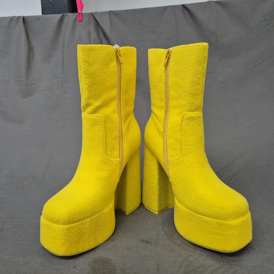 BOXED PAIR OF KOI TELETUBBIES PLATFORM BLOCK HEEL BOOTS IN YELLOW UK SIZE 3