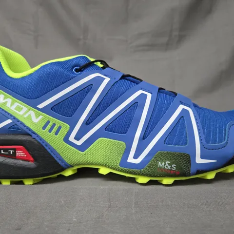 BOXED PAIR OF SALOMON SHOES IN BLUE/LIME UK SIZE 11