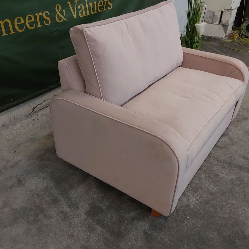 THE DUNSMORE LOVE SEAT SOFA BED UPHOLSTERED IN PETAL PINK FABRIC 