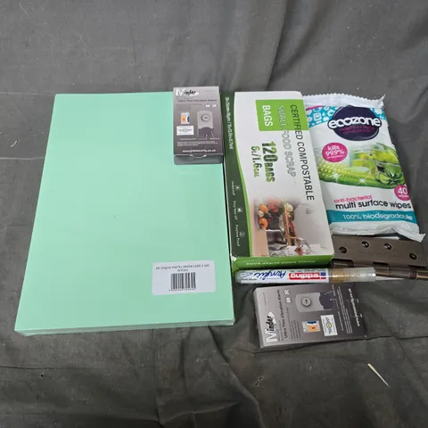 APPROXIMATELY 12 ASSORTED HOUSEHOLD ITEMS TO INCLUDE ULTRA THIN VIBRATION ALARM, A4 PASTEL GREEN, SMALL FOOD SCRAP BAGS, ETC