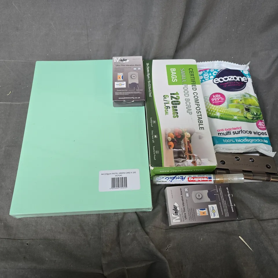 APPROXIMATELY 12 ASSORTED HOUSEHOLD ITEMS TO INCLUDE ULTRA THIN VIBRATION ALARM, A4 PASTEL GREEN, SMALL FOOD SCRAP BAGS, ETC