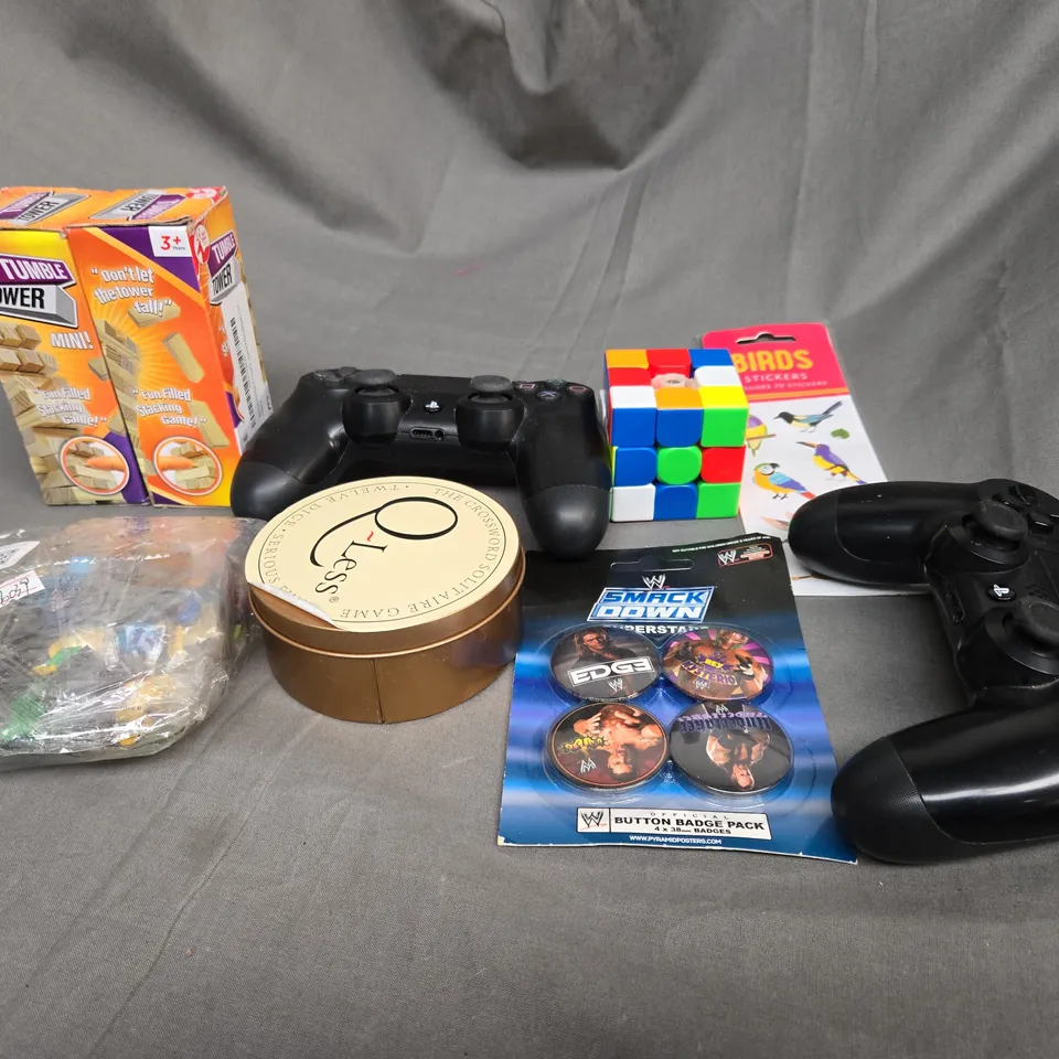 APPROXIMATELY 10 ASSORTED TOYS AND GAMES TO INCLUDE GAME CONTROLLERS, RUBIKS CUBE AND TUMBLE TOWERS