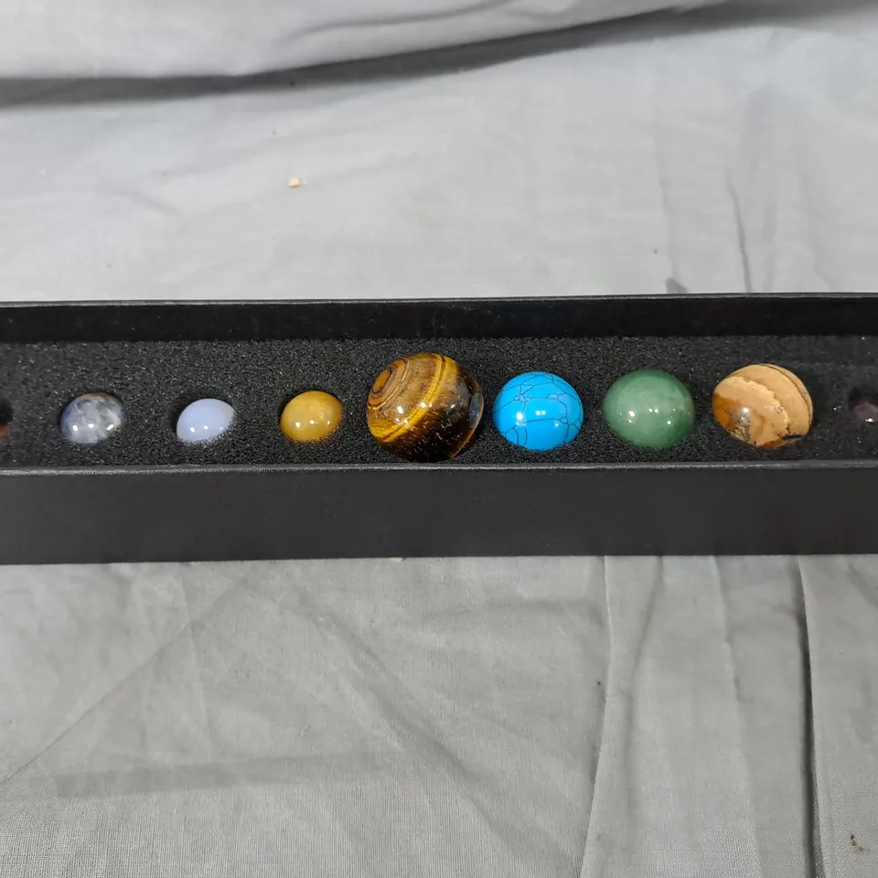 SET OF EIGHT POLISHED PLANET THEMED MARBLES 
