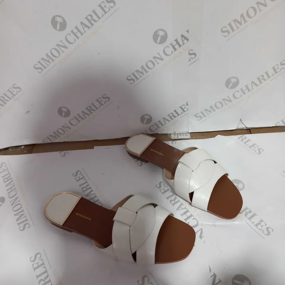 BOXED PAIR OF PRETTY LITTLE THINGS WHITE FLAT SANDALS 