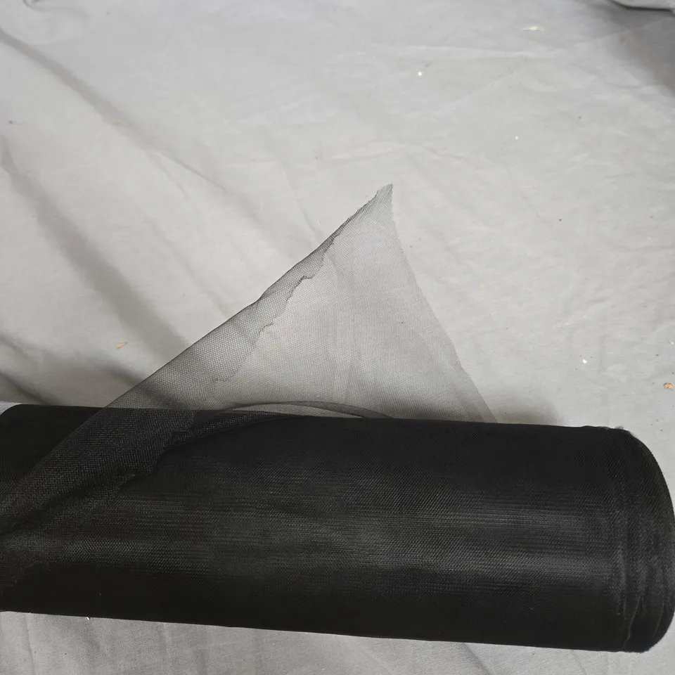 ROLL OF BLACK MESH FABRIC ON SPOOL WITH SILVER FOIL WRAP