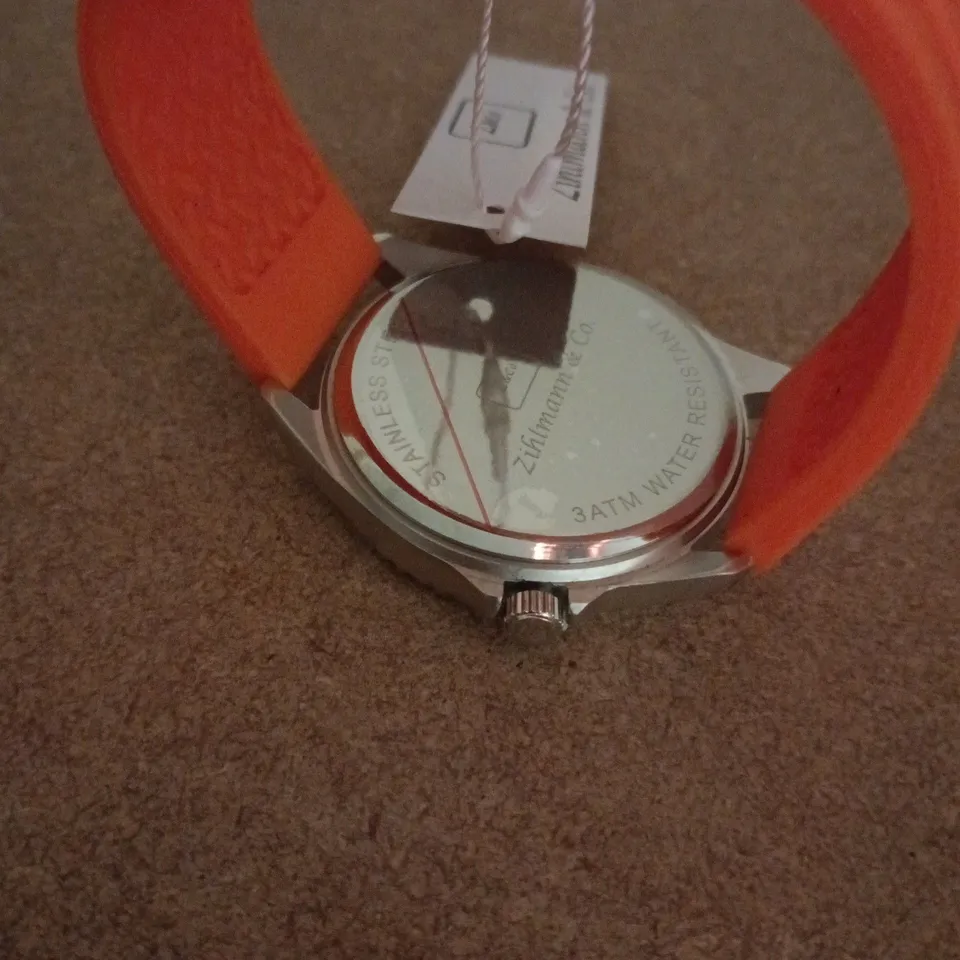 ZIHLMANN & CO STAINLESS STEEL WATCH WITH ORANGE DIAL & ORANGE RUBBER STRAP