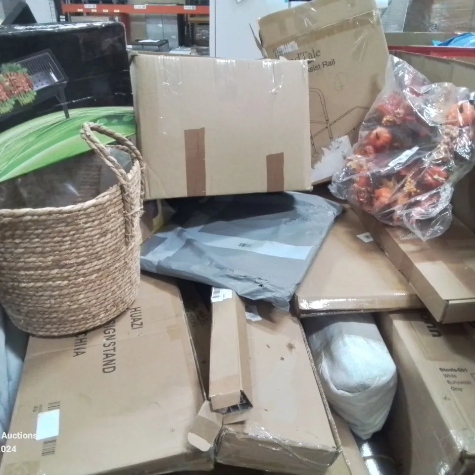 PALLET CONTAINING VARIOUS ASSORTED ITEMS TO INCLUDE: HALLOWEEN DECORATION, PORTABLE BARBECUE, BED ASSIST RAIL WICKER BASKET AND LOTS MORE UNMARKED BOXED ITEMS 