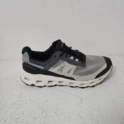 UNBOXED PAIR OF ON RUNNING CLOUDVISTA TRAIL RUNNING SHOES IN A BLACK AND WHITE COLORWAY - UK 6.5