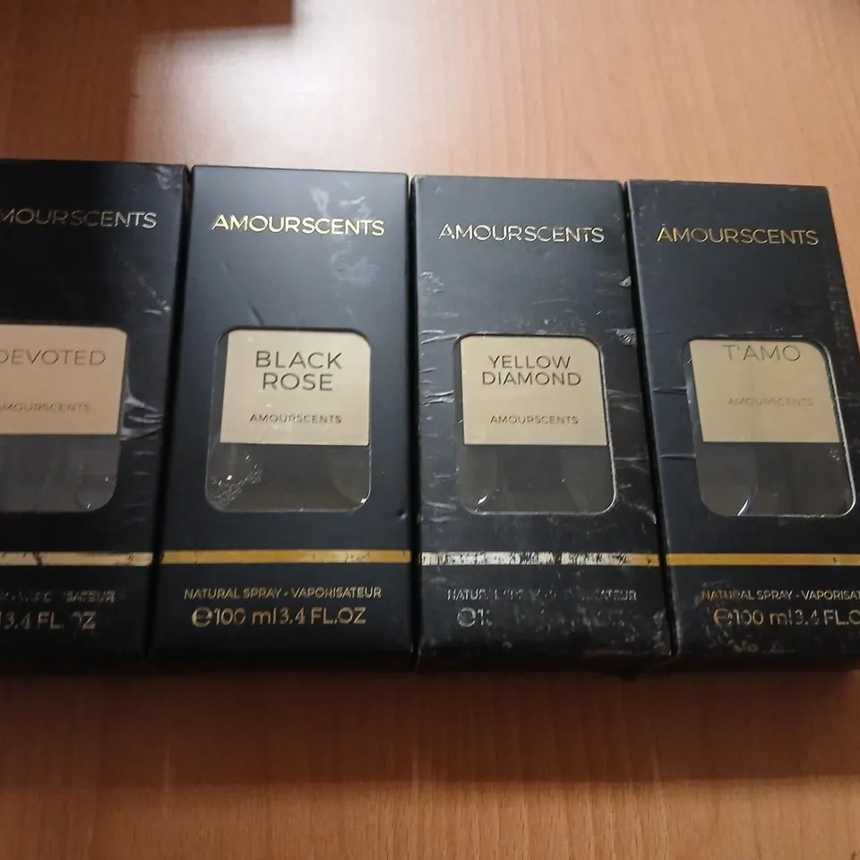 FOUR ASSORTED AMOURSCENTS 100ML TO INCLUDE; BLACK ROSE, YELLOW DIAMOND, T'AMO AND DEVOTED
