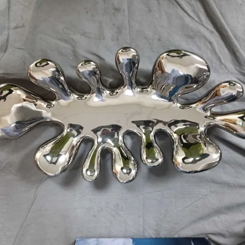 Chrome-plated decorative serving dish with lobed edges