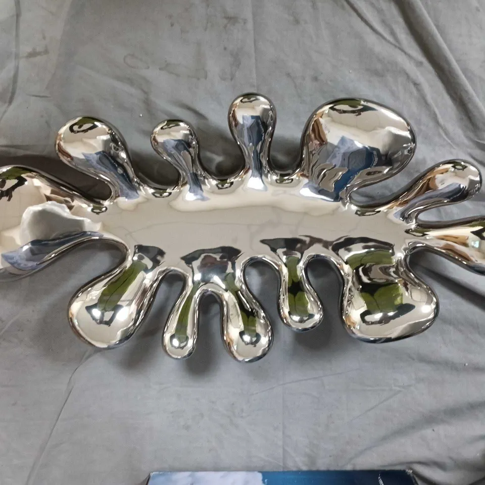 Chrome-plated decorative serving dish with lobed edges