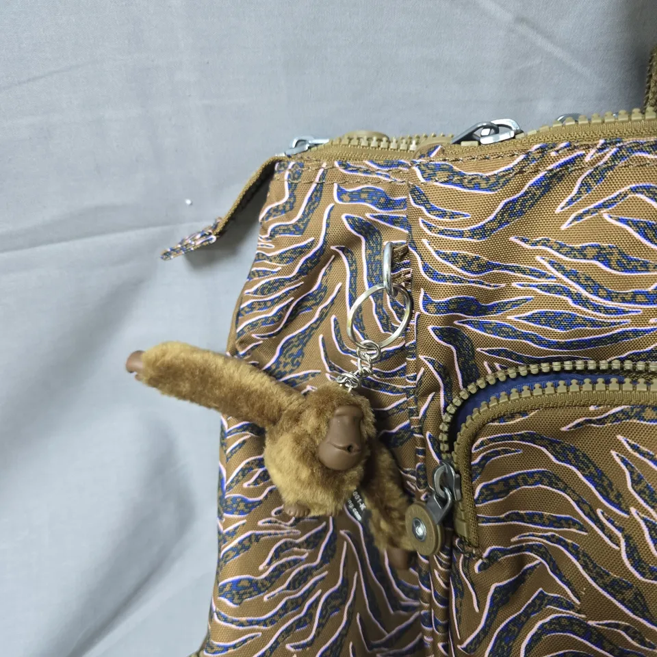KIPLING HANDBAG WITH MONKEY KEYCHAIN – TAN/BROWN FABRIC WITH BLUE PATTERN