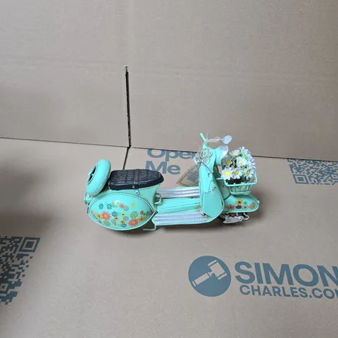 TURQUOISE TIN TOY SCOOTER WITH FLORAL DECORATION