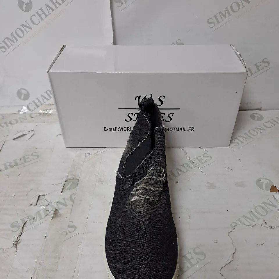 APPROXIMATELY 10 PAIRS  OF BOXED W.S SLIP ON BLACK DISTRESSED FLAT TRAINERS IN VARIOUS SIZES