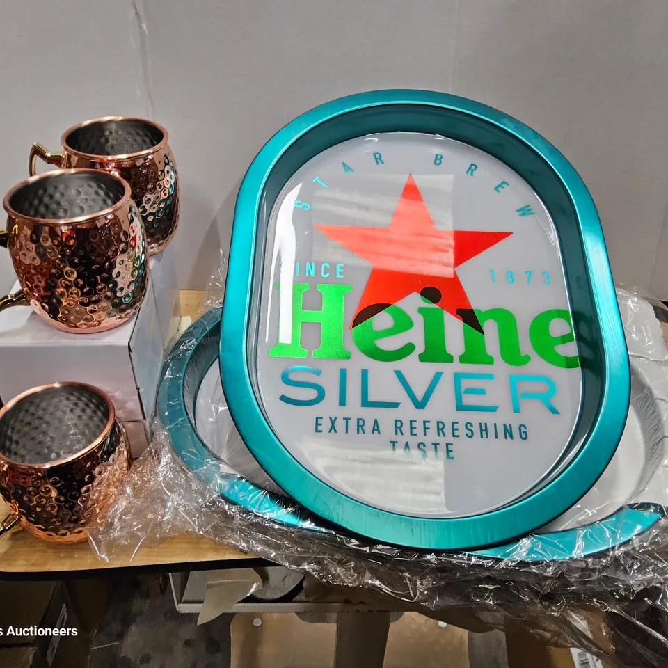 FIVE COPPER PLATED TANKARDS & 3 HEINEKEN OVAL METAL TRAYS