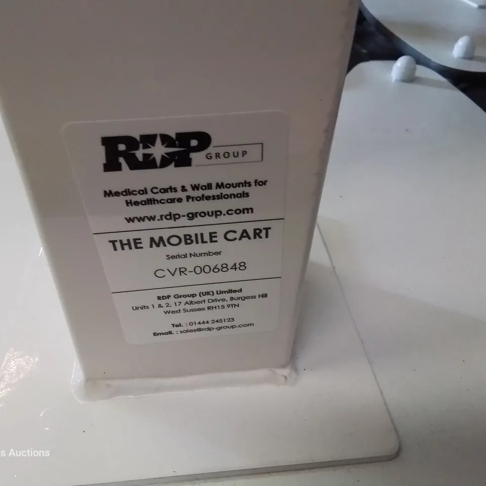 APPROXIMATELY 26 ASSORTED MEDICAL MOBILE CARTS WITH MONITOR STANDS & POWER CABLES
