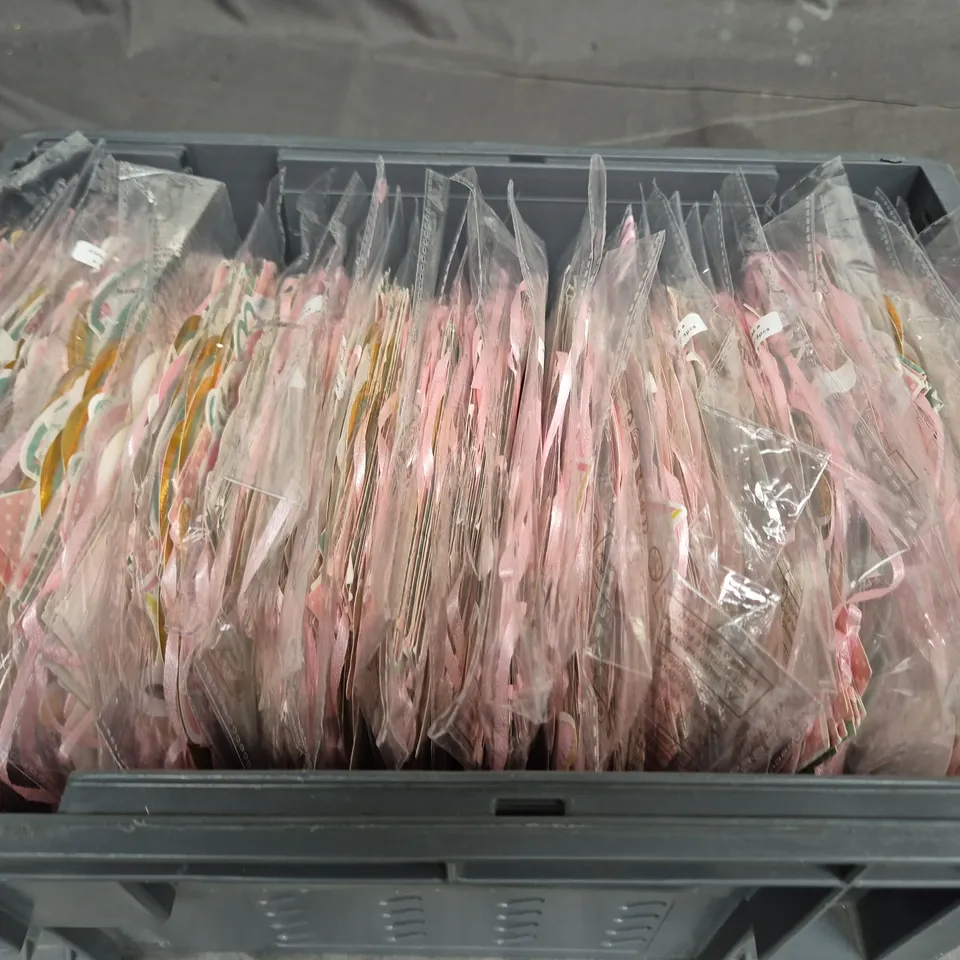 TOTE OF APPROXIMATELY 20 PACKS OF CELEBRATION DECORATIONS