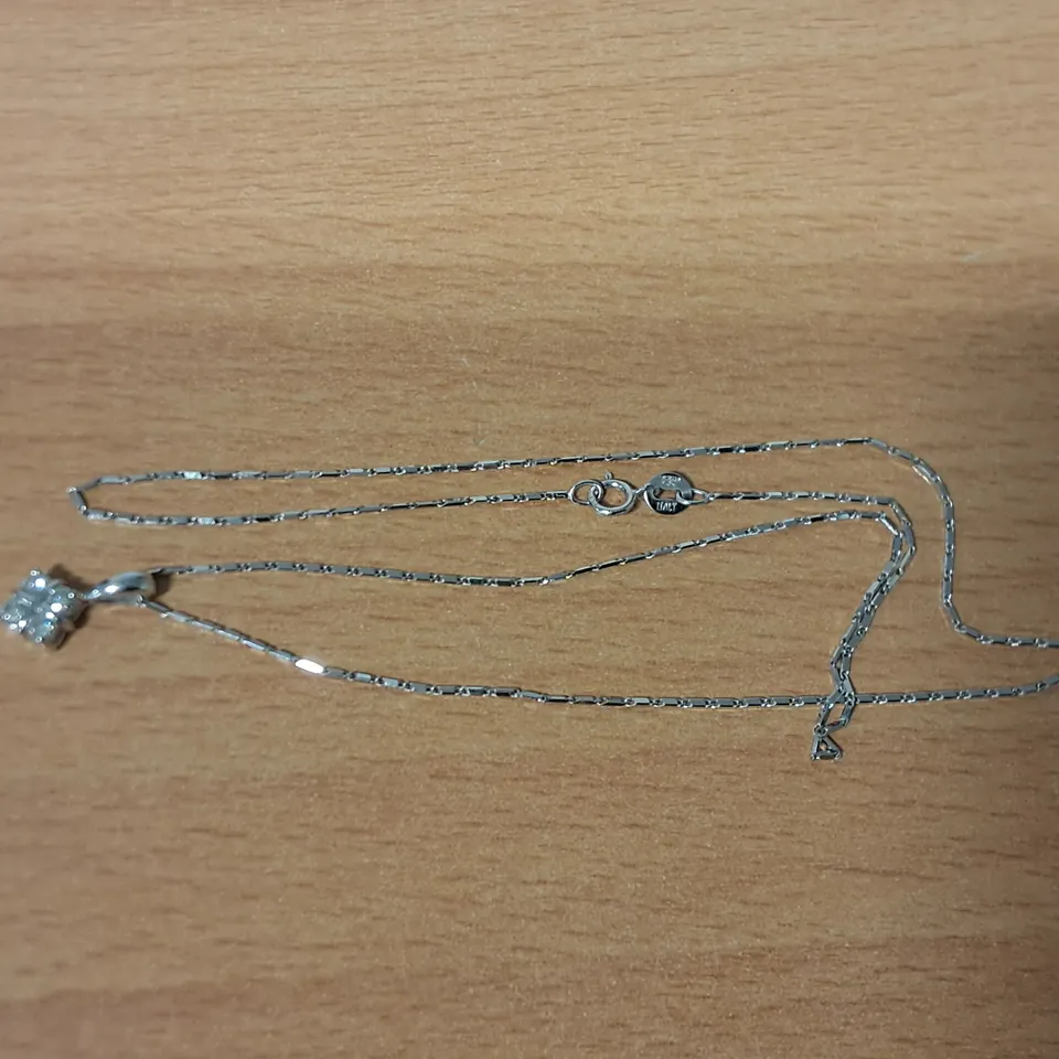 18CT WHITE GOLD SALTIRE PENDANT ON CHAIN SET WITH NATURAL DIAMONDS