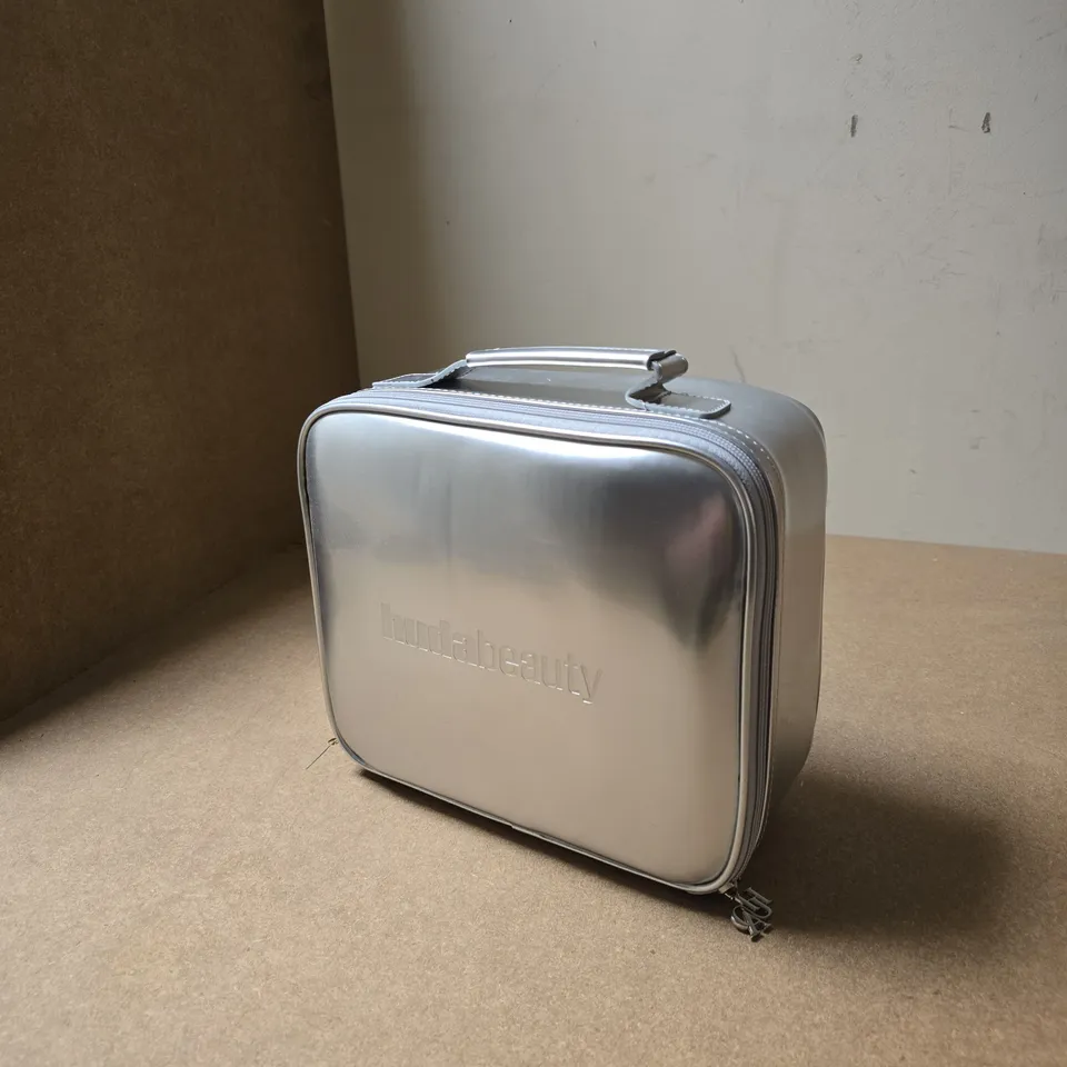 HUDABEAUTY ASSORTED COSMETICS IN SIVER CARRY CASE 