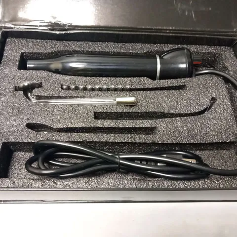 BOXED HAND HOLDING HIGH FREQUENCY INSTRUMENT