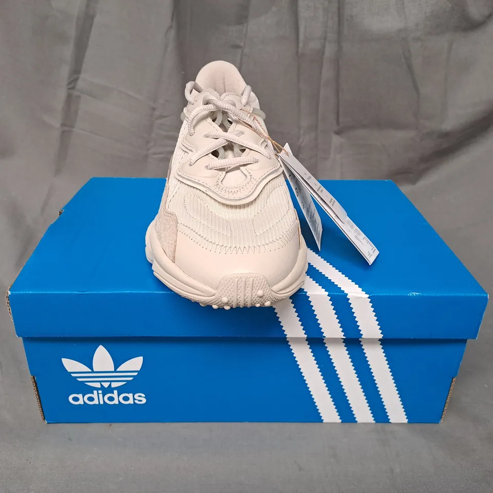BOXED PAIR OF ADIDAS OZWEEGO SHOES IN CREAM UK SIZE 5
