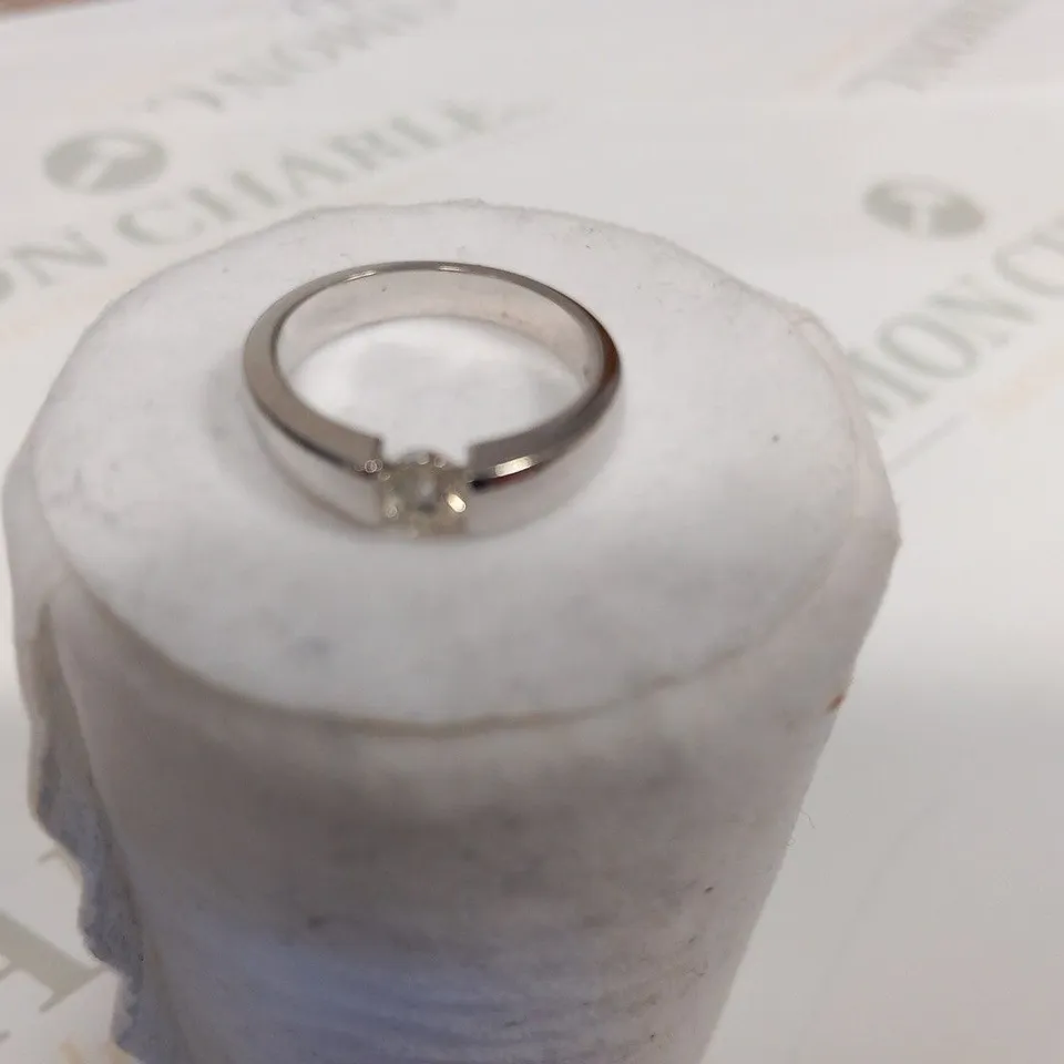 DESIGNER 18CT WHIT GOLD RING WITH A SEMI TENSION SET DIAMOND WEIGHING +0.50CT