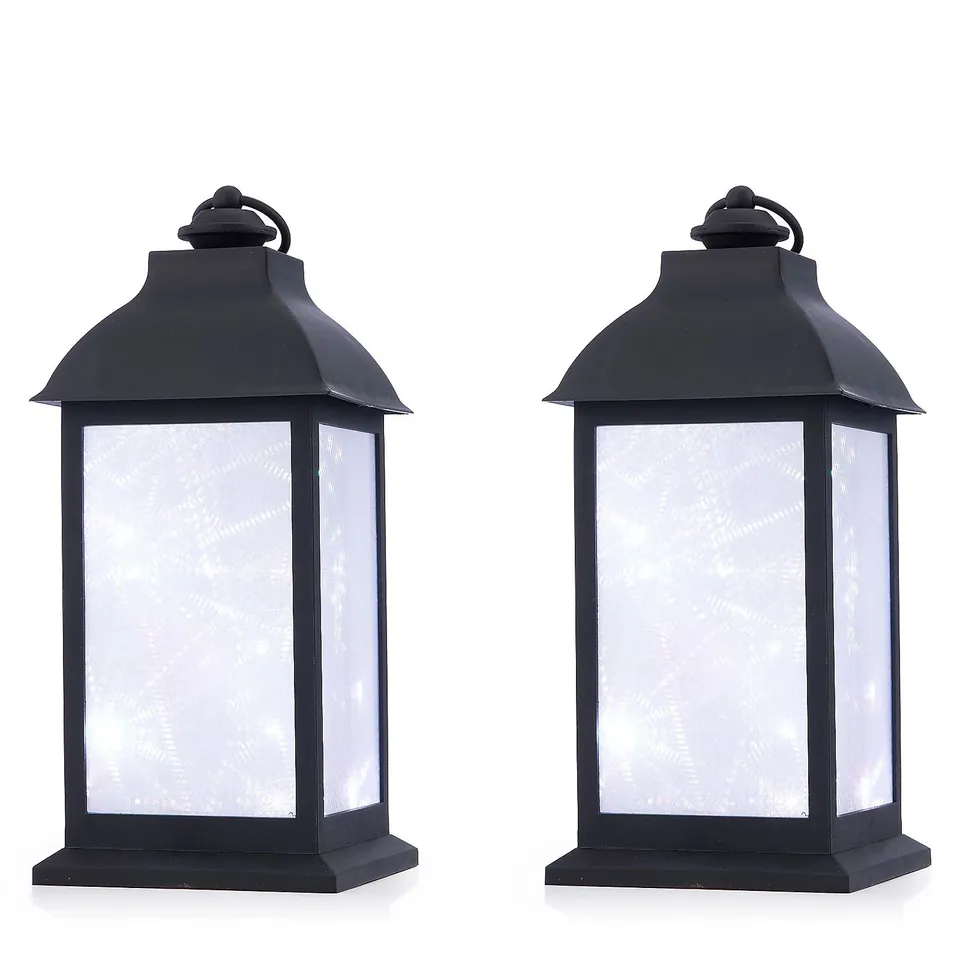 HOME STORIES SET OF 2 INDOOR / OUTDOOR LED EFFECT LANTERNS.