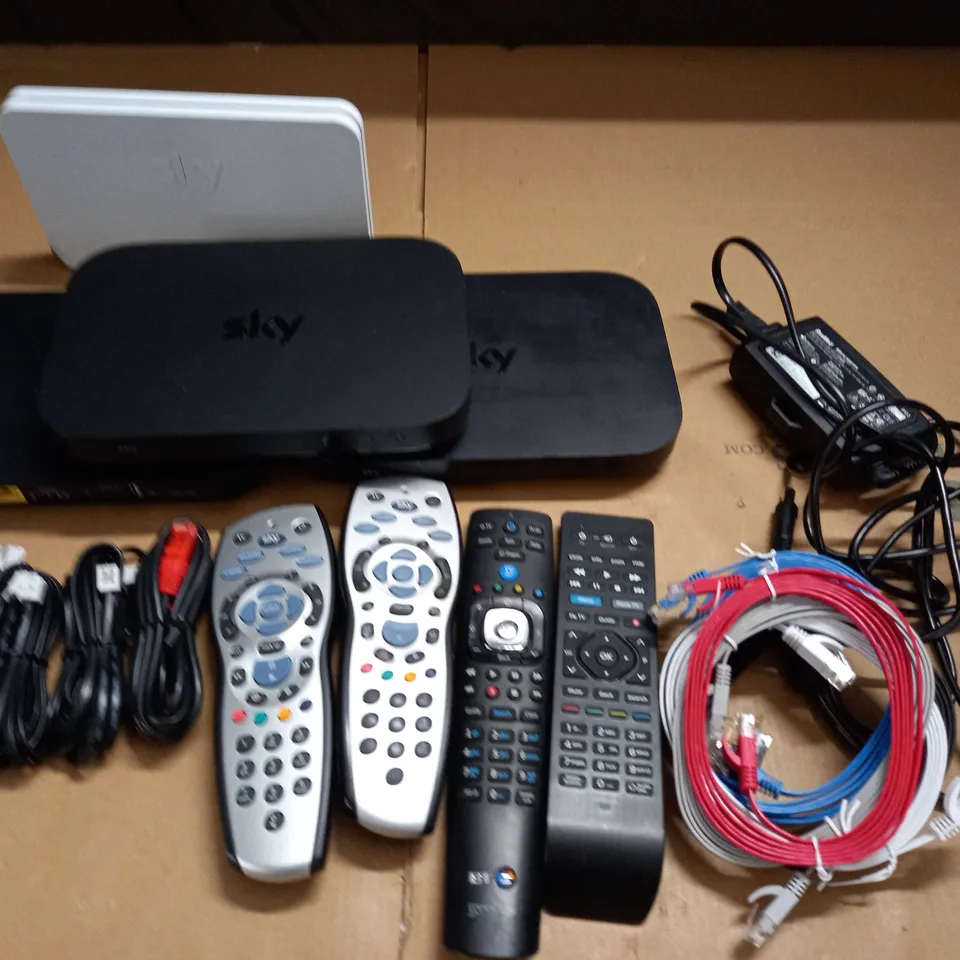 LOT OF ASSORTED TECH ITEMS TO INCLUDE SKY ROUTERS, CABLES AND VARIOUS REMOTES