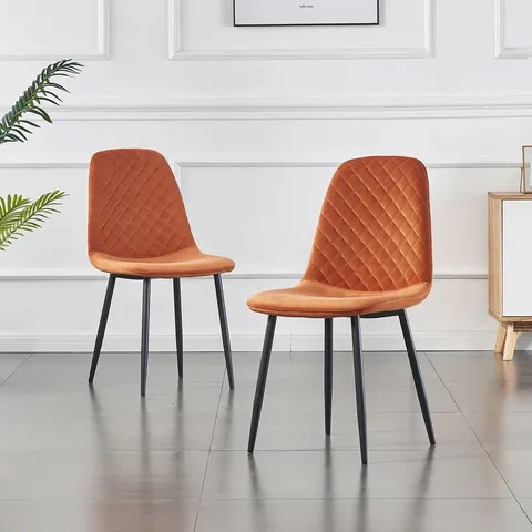 BOXED PAIR OF BRIENNA VELVET UPHOLSTERED ARMLESS DINING CHAIRS - ORANGE (1 BOX)