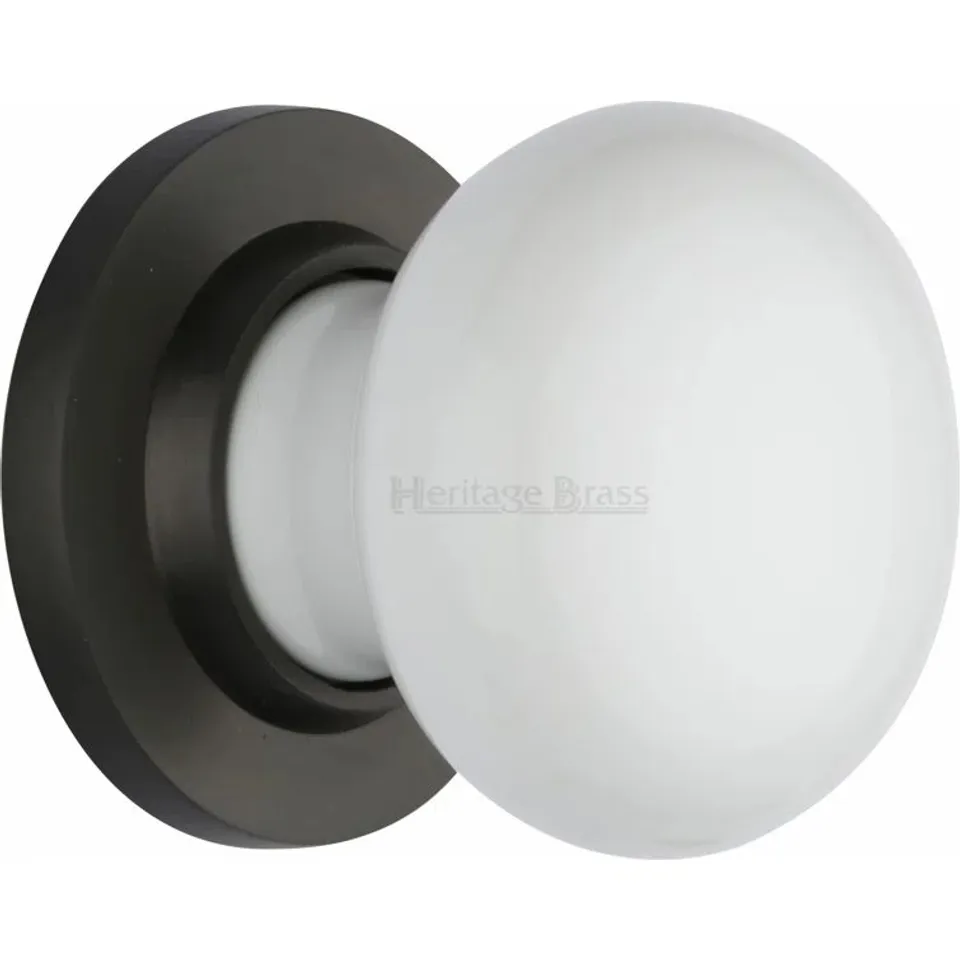 PAIR PASSAGE DOOR KNOBS WHITE CERAMIC / ANTIQUE BRASS