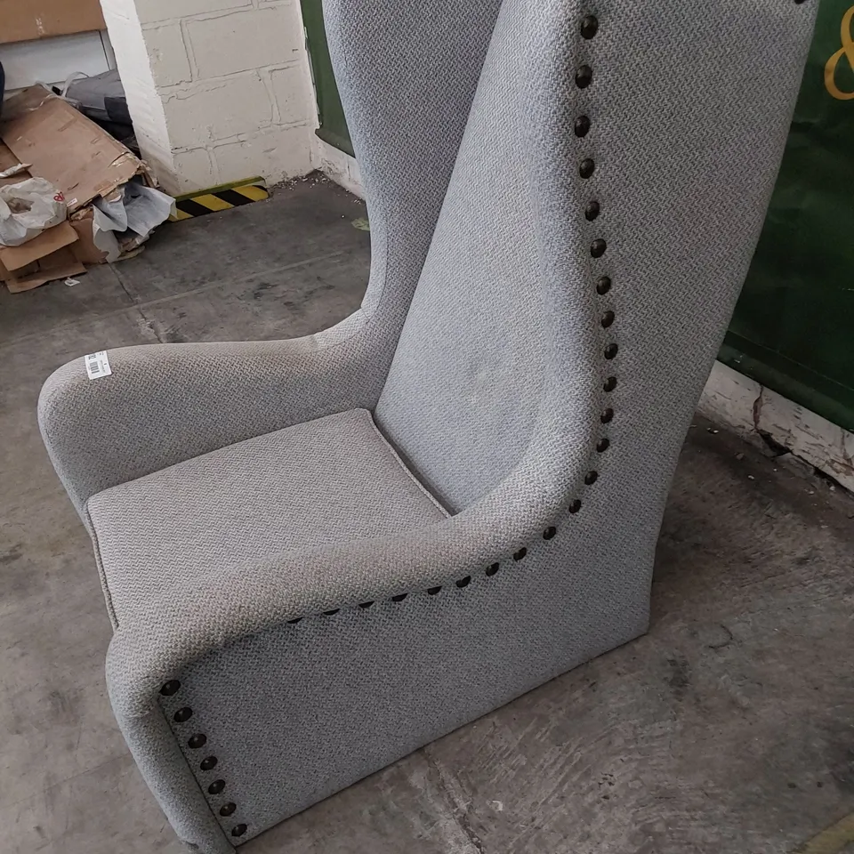 DESIGNER HIGH BACKED WINGED EASY CHAIR WITH STUDDED DETAIL 