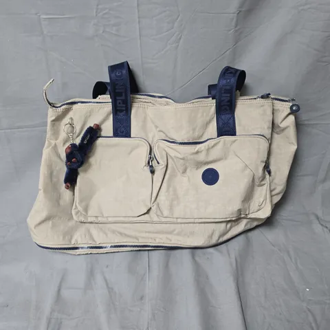 KIPLING BEIGE TOTE BAG WITH NAVY HANDLES AND MONKEY KEYCHAIN