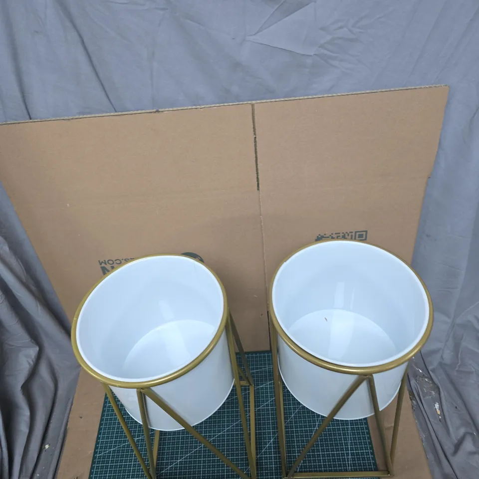 PAIR OF WHITE CERAMIC PLANTERS ON GOLD-TONE GEOMETRIC STANDS