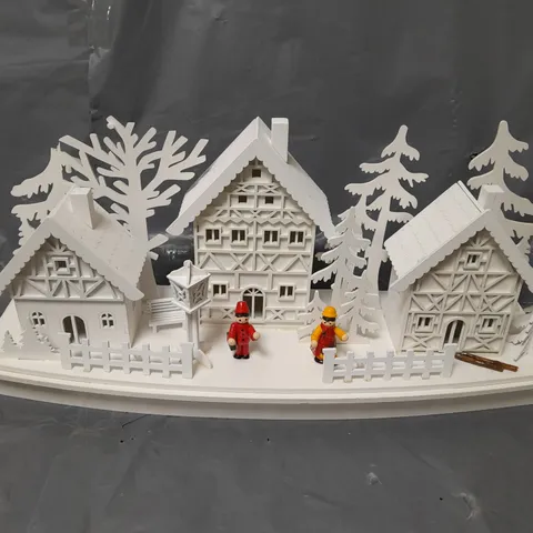 WHITE WOOD LIT VILLAGE SCENE