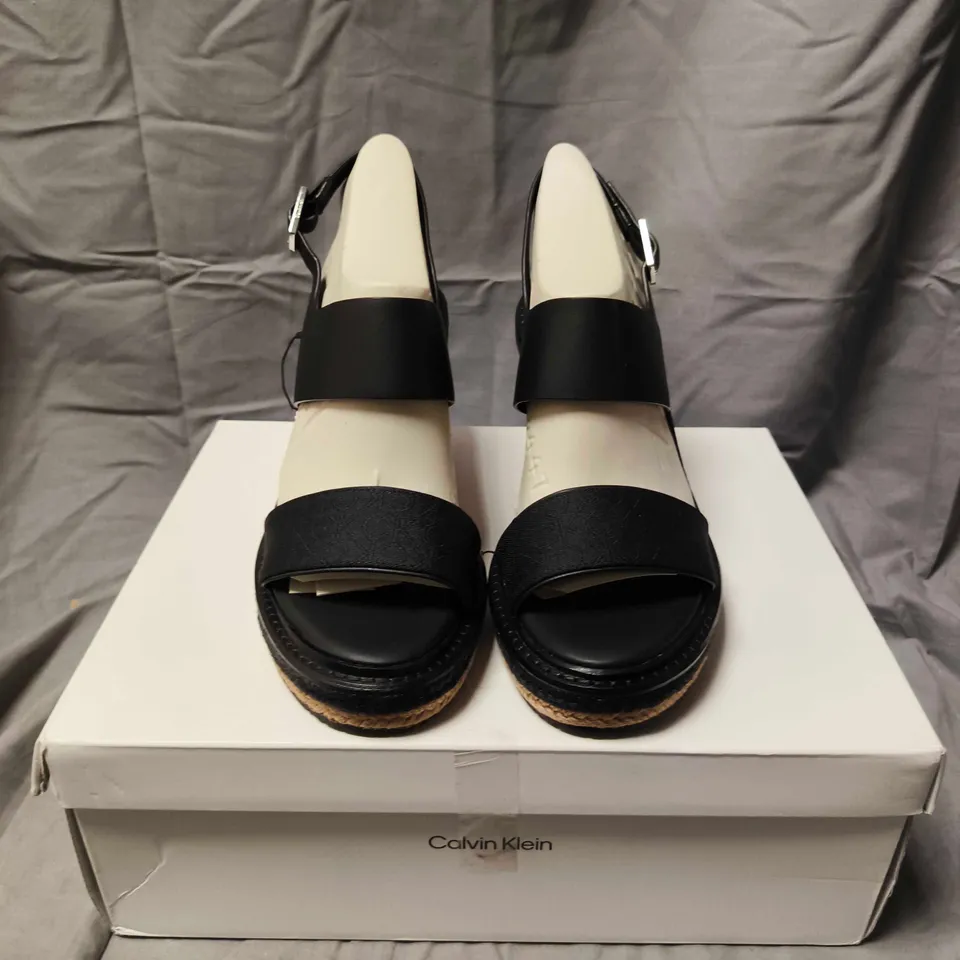 BOXED PAIR OF CALVIN KLEIN BLACK LEATHER WEDGE SANDALS – WOMEN'S SIZE 6 