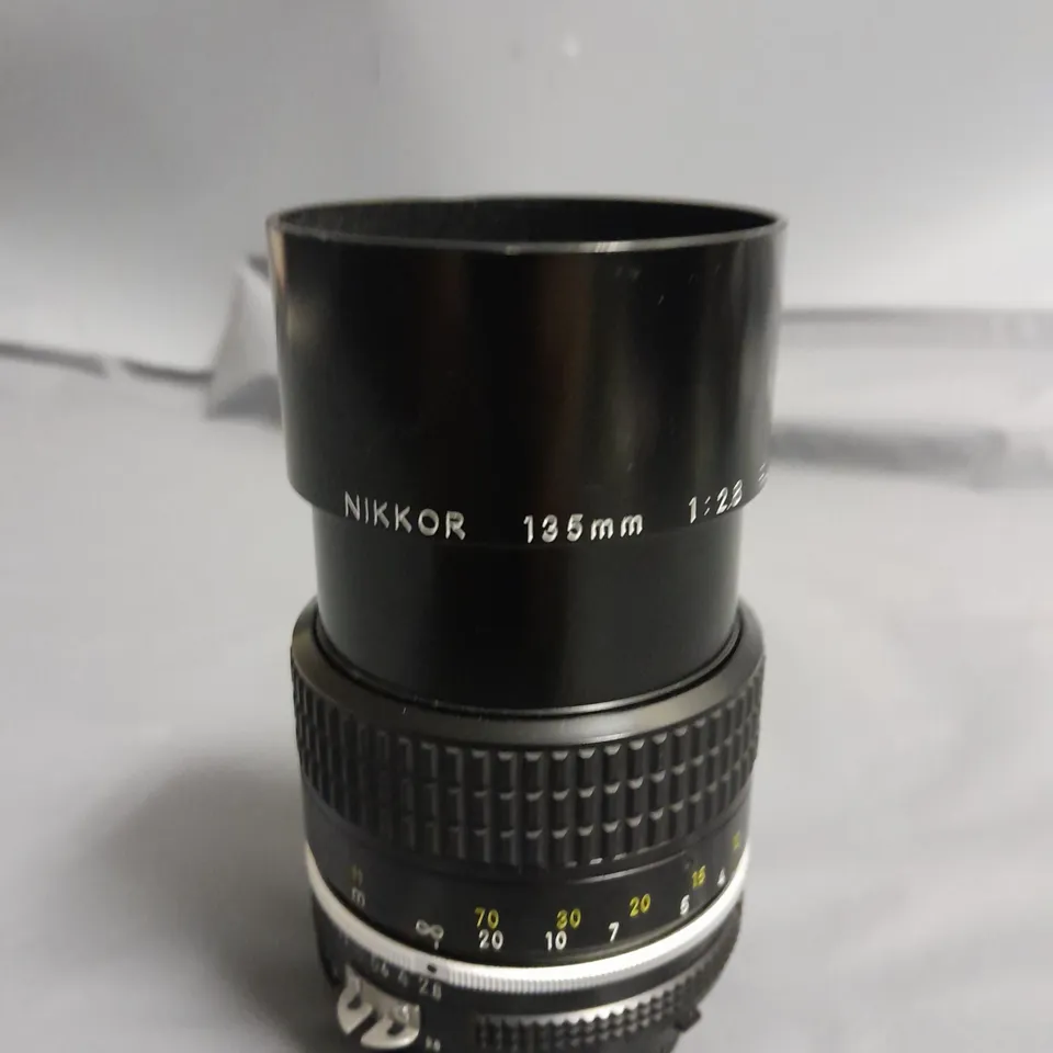 NIKON NIKKOR 135MM LENSE- 1:28 906349