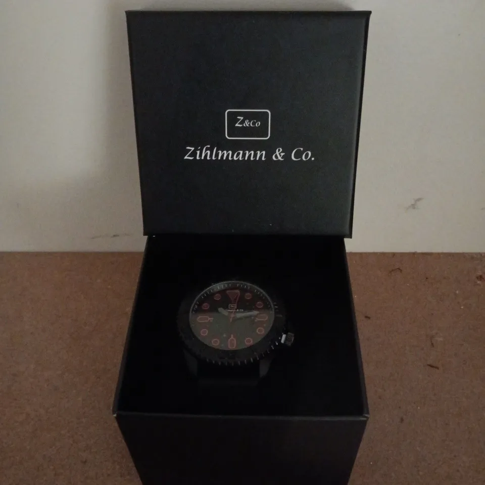 ZIHLMANN & CO STAINLESS STEEL WATCH WITH BLACK DIAL & BLACK RUBBER STRAP