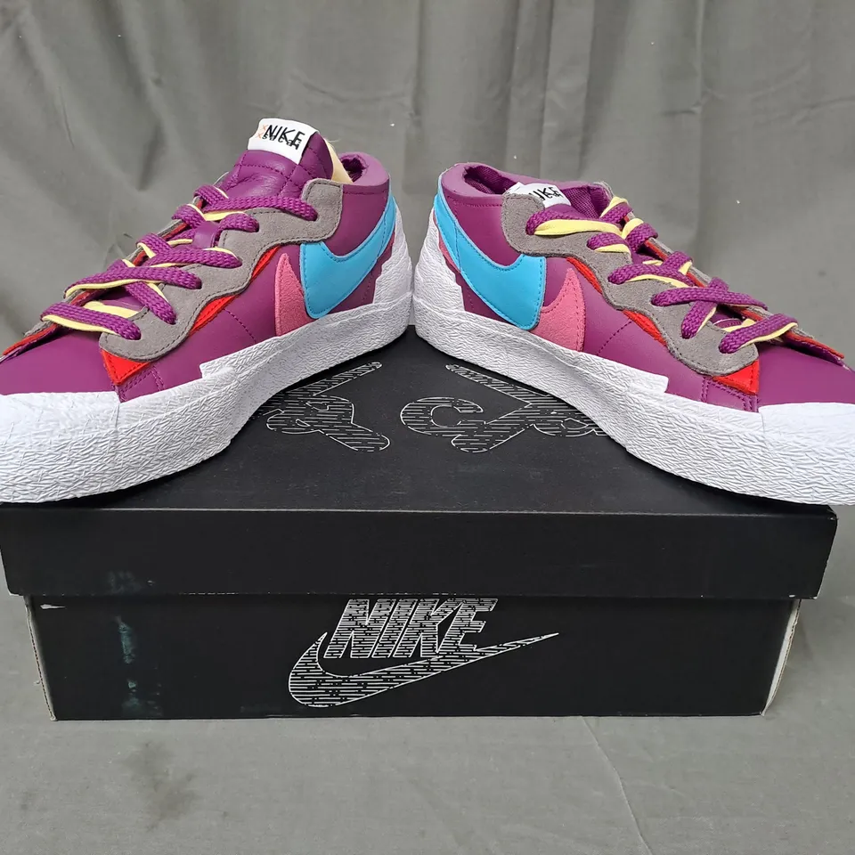 BOXED PAIR OF NIKE BLAZER LOW/SACAI/KAWS SHOES IN PURPLE/BLUE/PINK/WHITE UK SIZE 10