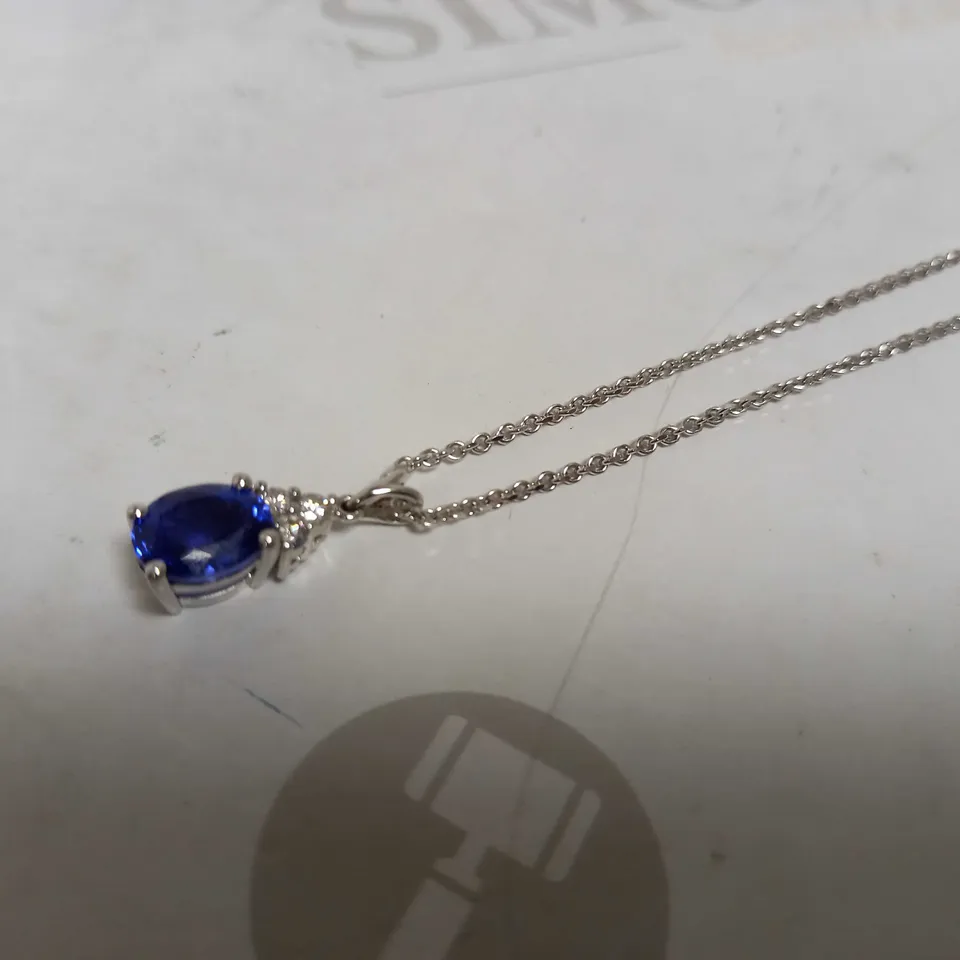 DESIGNER 18CT WHITE GOLD PENDANT ON A CHAIN, SET WITH AN OVAL CUT TANZANITE AND DIAMONDS WEIGHING +-2.67CT