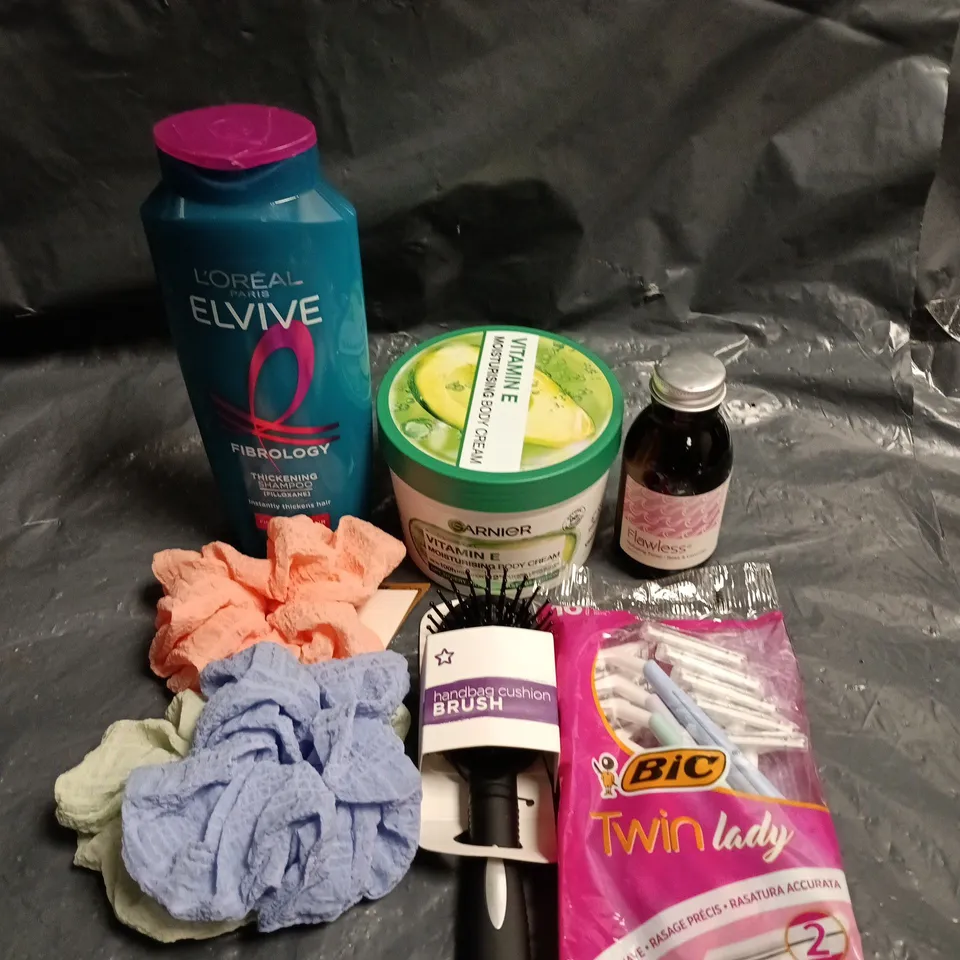 APPROXIMATEY 20 ASSORTED HEALTH AND BEAUTY PRODUCTS TO INCLUDE - L'OREAL ELVIVE THICKENING SHAMPOO - GARNIER VITAMIN E MOISTURISING BODY CREAM AND ASSORTED HAIR SCRUNCHIES