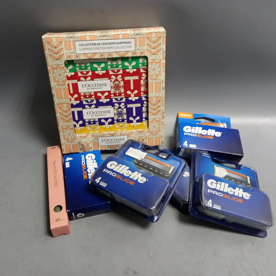 APPROXIMATELY 7 ASSORTED PORDUCTS TO INCLUDE L'OCCITANE SUPRISE FIRECRACKERS COLLECTION, GILETTE PROGLIDE CARTRIDGES, WAVE FOUNTAIN PEN 