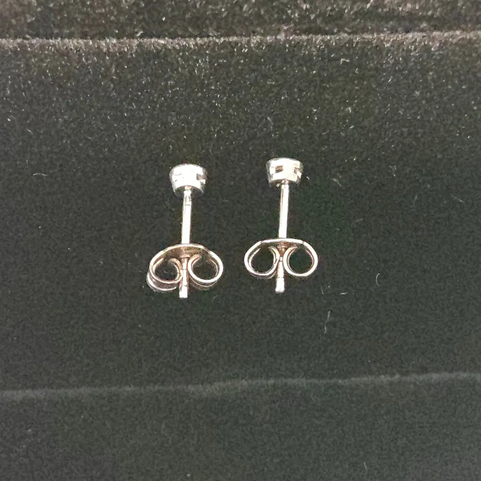 18CT WHITE GOLD RUB-OVER STUDS SET WITH NATURAL DIAMONDS