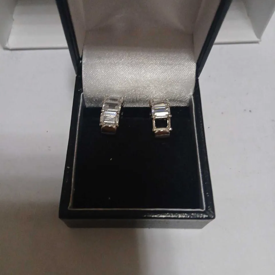 DIAMONIQUE HUGGIE STERLING SILVER EARRINGS