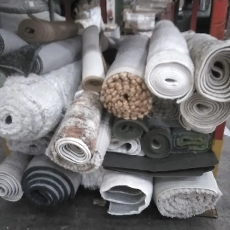 STILLAGE OF APPROXIMATELY 24 DESIGNER RUGS