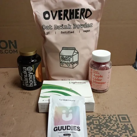 TOTE OF APPROXIMATELY 15 ASSORTED HEALTH/VITAMIN RELATED ITEMS TO INCLUDE OVERHERD OAT DRINK POWDER, LIGNOSUS, APPLE CIDER VINEGAR GUMMIES, GUUDIES, MANUKA HONEY GUMMIES ETC